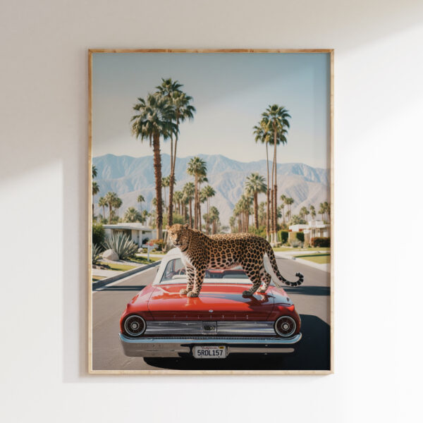 Leopard red classic car wall art image 1 with a poised leopard set against a red classic car, desert light, and palm-lined California mood