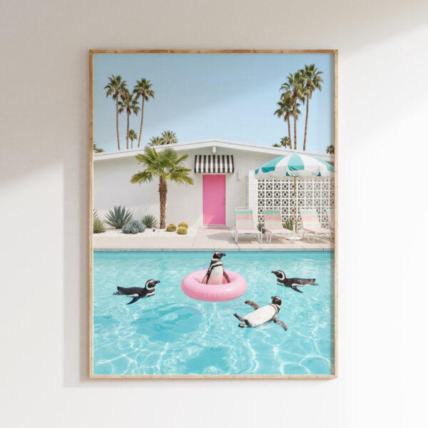 Penguin pool ring wall art with pink float in a Palm Springs-inspired turquoise pool