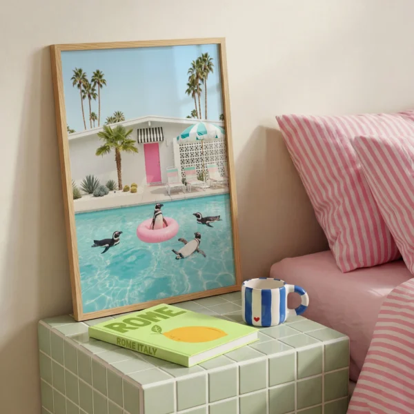 Framed penguin pool ring wall art styled in a bright modern interior