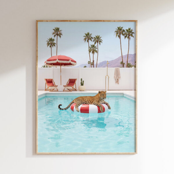 Leopard on a red pool float in a Palm Springs pool courtyard wall art