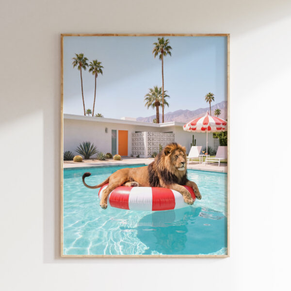 Framed Lion at Leisure art print showing a lion on a red-and-white pool float in a turquoise Palm Springs pool