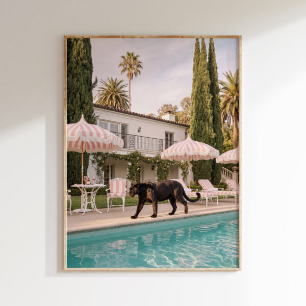 Framed Cypress Pool Panther art print with a black panther beside a turquoise pool and pink striped umbrellas