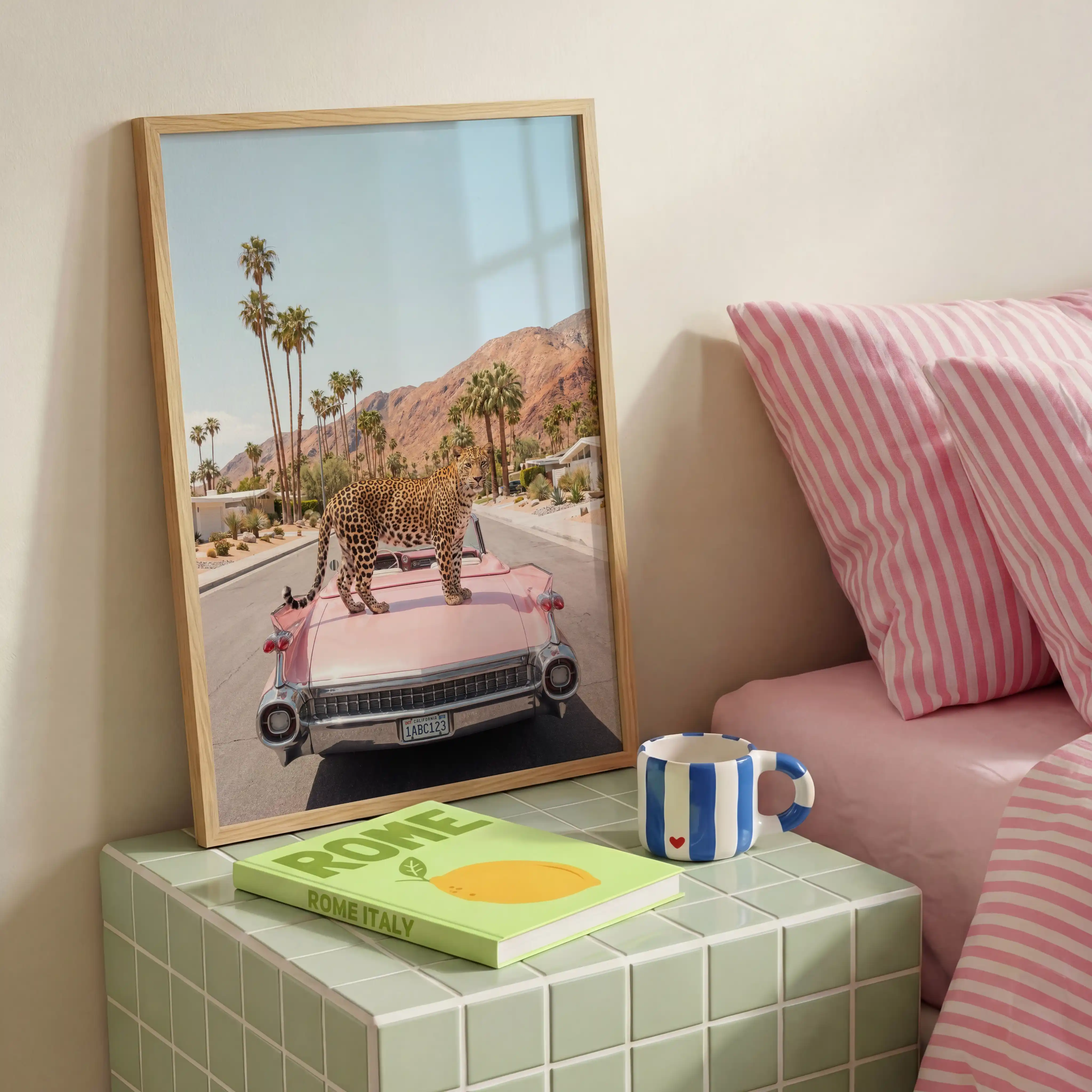 1959 Cadillac Eldorado leopard wall art beside pink striped bedding