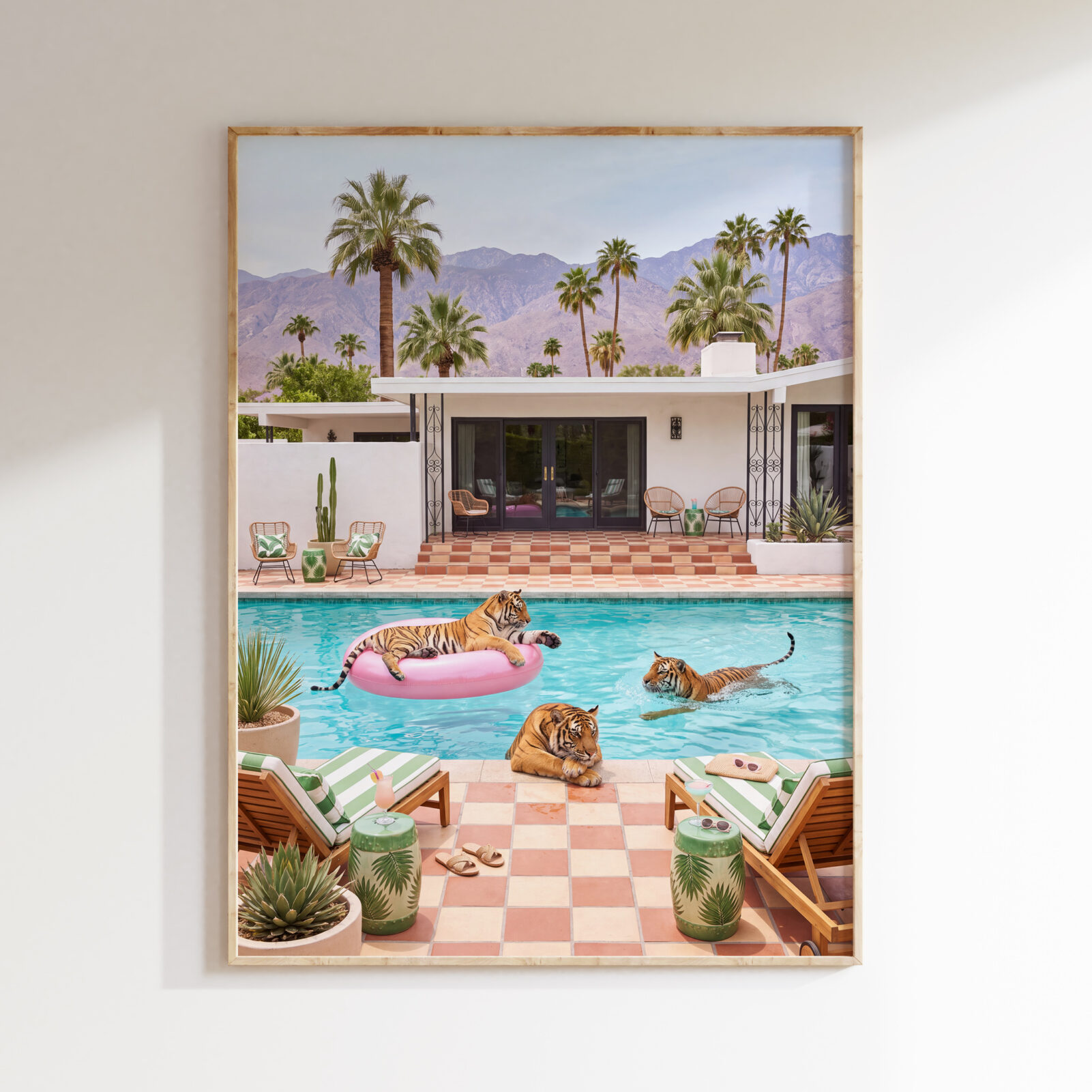 Framed Three Tigers Pool Party print showing three tigers around a turquoise resort pool, with palms and mountains
