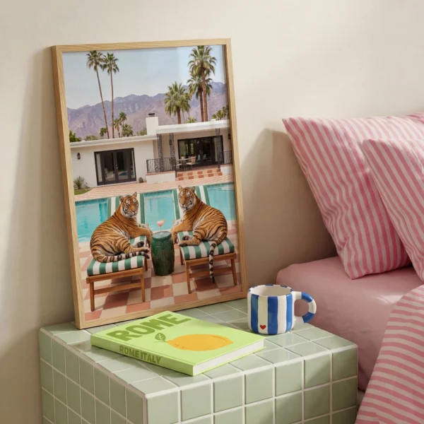 Two tigers lounge chair framed print beside pink striped bedding