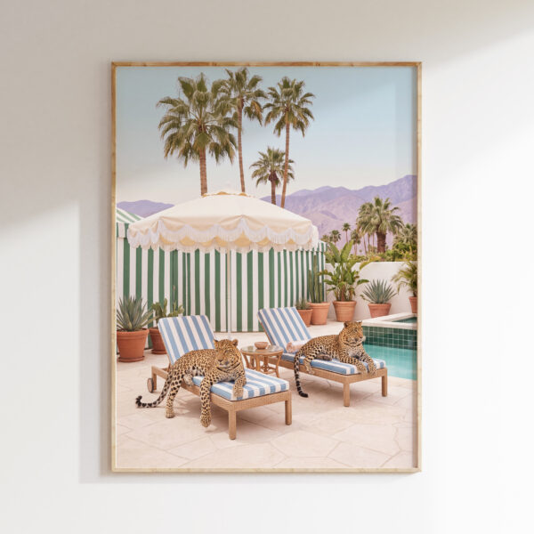 Two leopards poolside wall art on striped lounge chairs by a turquoise pool