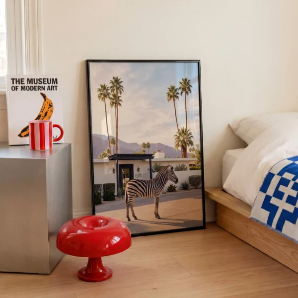 Palm Springs zebra framed print beside modern bedroom decor